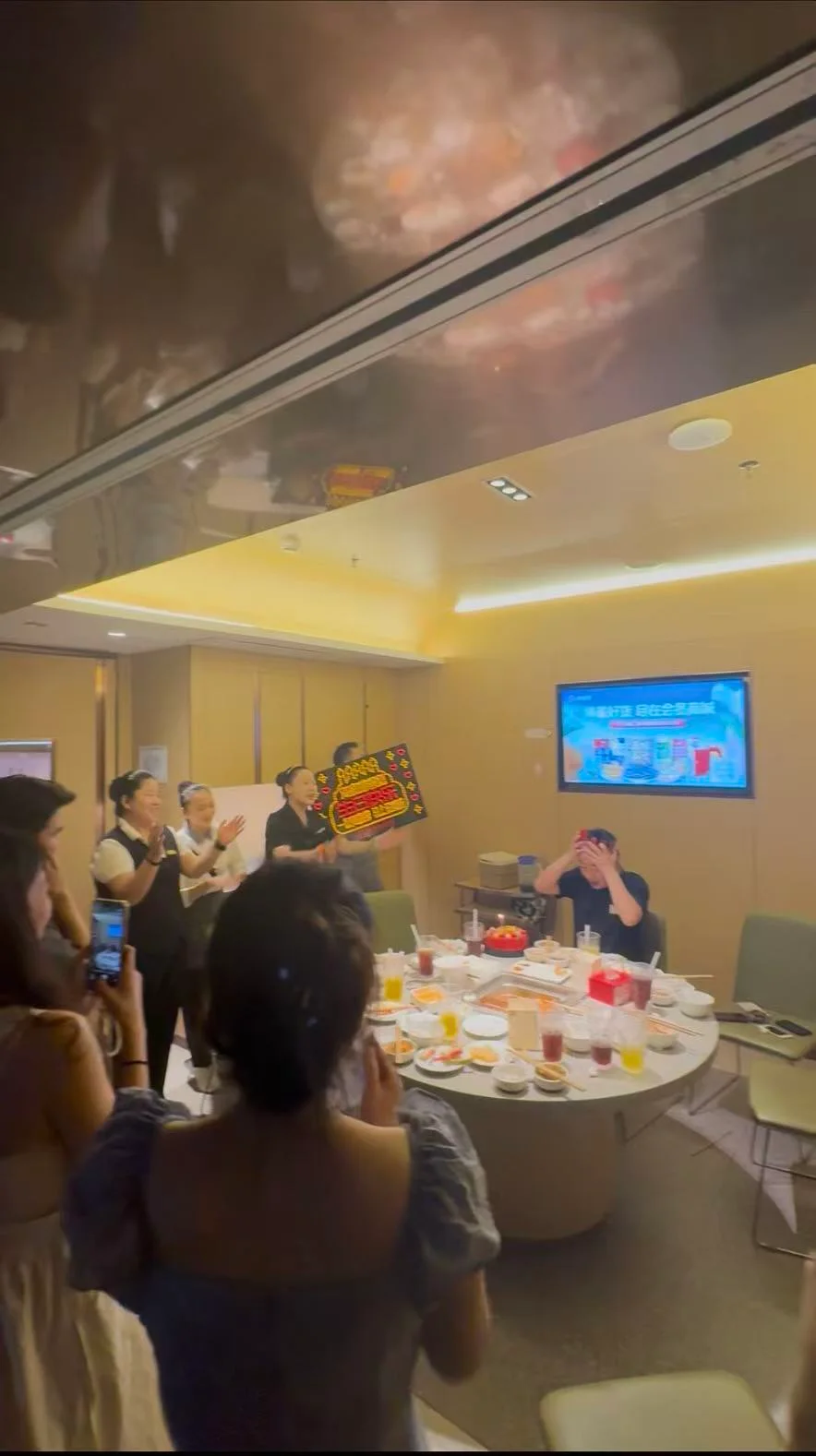 Xunding colleagues sharing a meal around a round dining table