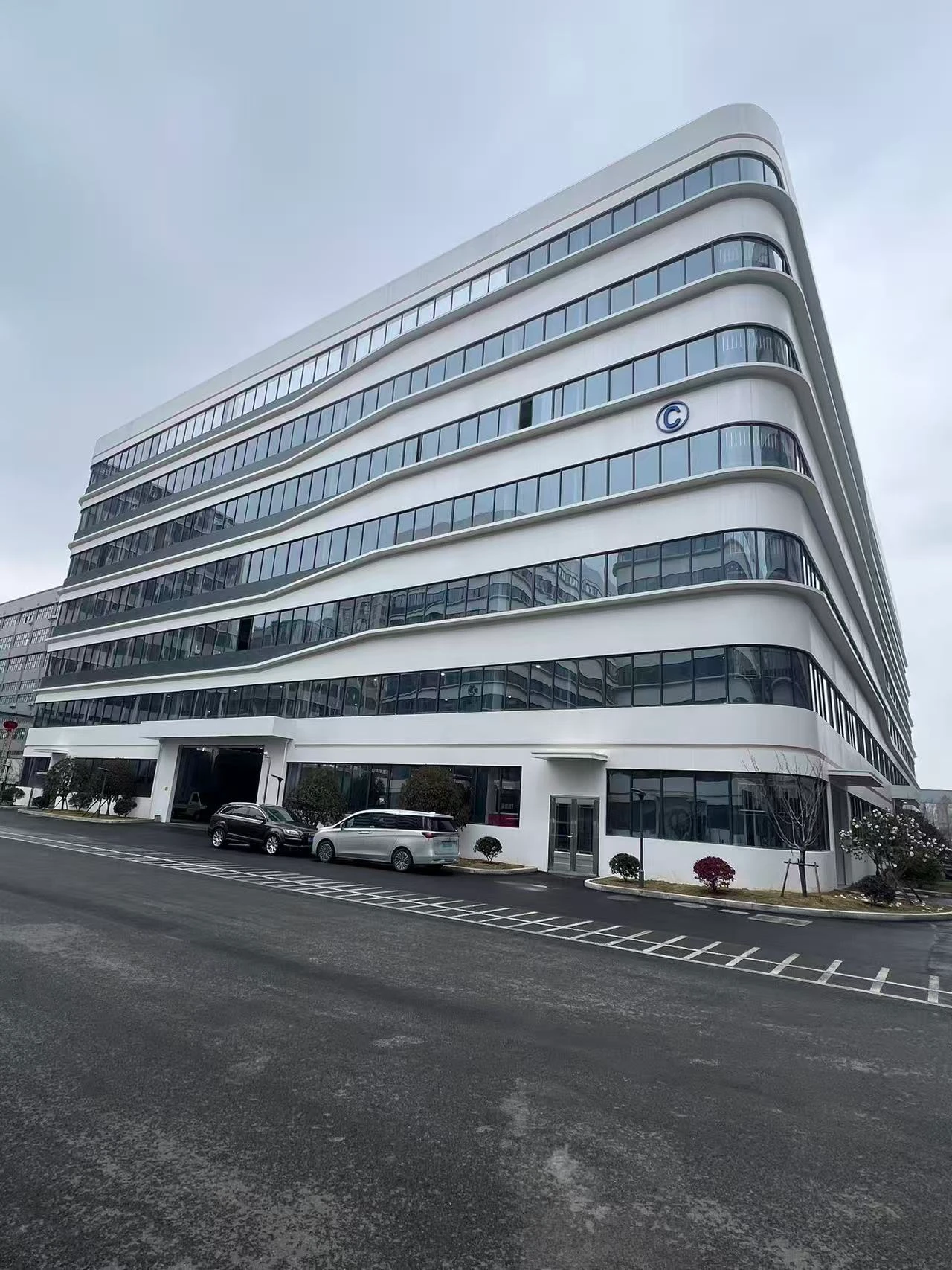 The curved facade of the building in the company-supplied photograph